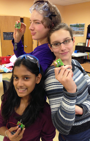 Three of Fritz's eighth graders display circuits they built in their Project Lead the Way unit.